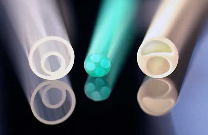 Braided tubing formed into a coil